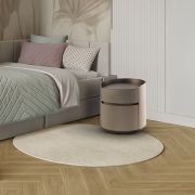 Mesita de noche redonda tapizada con dos cajones