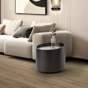 Mesita de noche redonda con un cajón y tapa en porcelánico